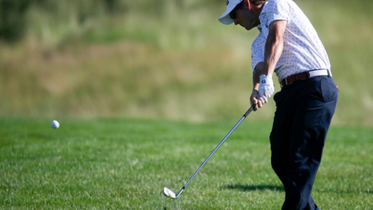 The Latest: Westwood surges to lead at US Open
